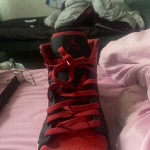 Black and red Jordan 1s mid